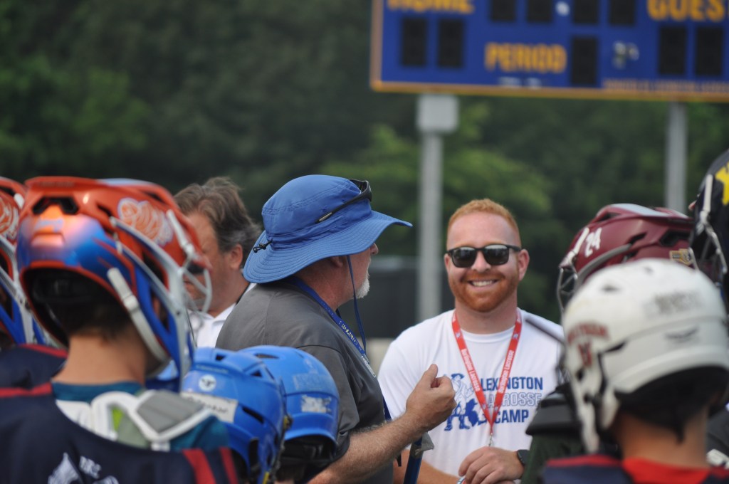 Battle Road campers in a huddle with their coaches